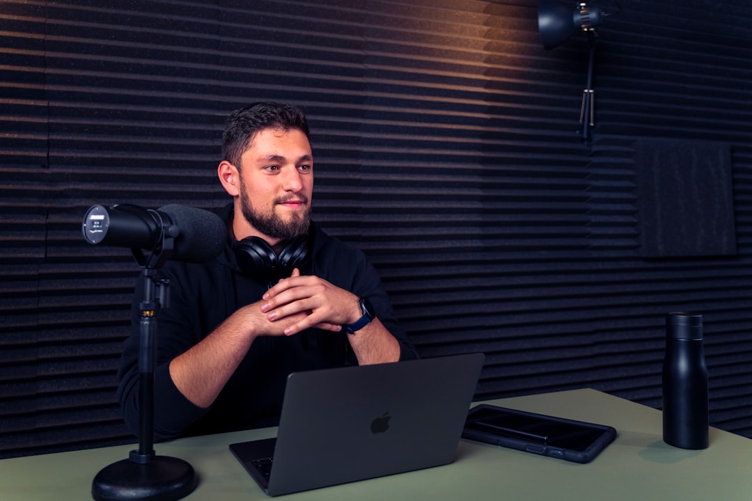 professional video creator workstation with laptop and mic