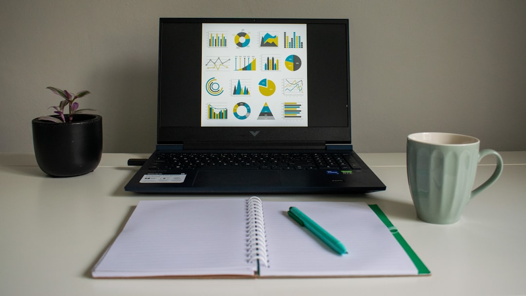 laptop spreadsheet data analysis office desk
